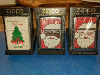 Zippo Christmas Lighters.  Black Santa White Santa.  Merry Christmas Tree And Deer