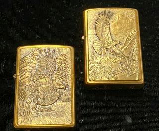 2 Zippo Lighters.  Gold Colored.  " American Eagles " 1996 And 2005.  In Boxes.  H5