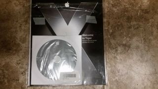 Apple iBook G4 User ' s Guide,  TIGER Mac OS X v10.  4 Software Install Discs 1 & 2 2