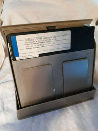 Gray 8 - inch floppy disk box (Digital branded) with 12 CP/M - related disks 2