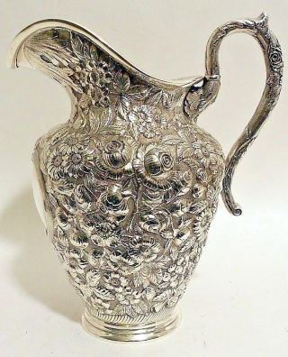 A Large Sterling Repousse Water Pitcher,  Hennegan,  Bates & Co. ,  Baltimore.