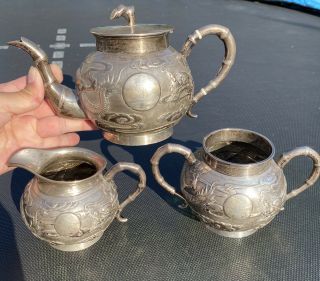 A Large Set 19th Century Chinese Carved Silver Dragon Tea Set