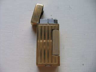 Dunhill Rollalite Petrol Lighter Swiss Made,  In Gilded Metal U.  S.  A.  Pat.  2102108