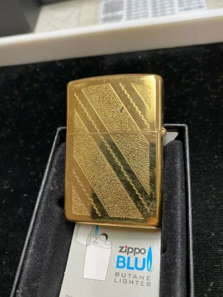 2 Zippo Lighters.  Gold Colored.  