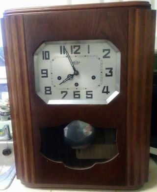 Early Twentieth Century Girodi French Oak Wall Clock With 2 Choices Of Chimes