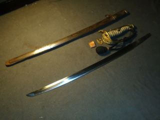 Japanese Meiji Army officer ' s sword in kyugunto mountings,  family blade,  knot 2
