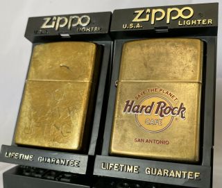 2 Vintage Zippo Brass Lighters 1998 Hard Rock San Antonio,  1999 No Heavy Lifting