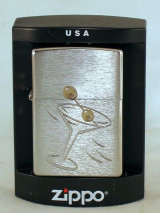 2 Lighters - A zippo & figural table lighter - both have a Martini Glass Motif 2