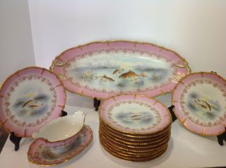 Limoges Porcelain Fish Set.  12 Plates,  Platter,  Sauce Boat.  Antique France.