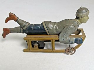 Antique Hess Boy On Sled Tin Litho Toy