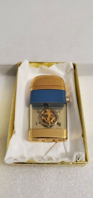 Vintage Scripto Vu Lighter: Compact: Goldenglo: 3d Wheel And Anchor W/ Blue Band