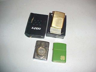 Three Zippo Lighters One