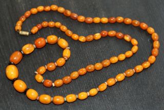 Antique Chinese Carved Butterscotch Amber Bead Necklace,  19th Century.  37 Grams.
