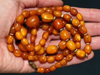 Antique Chinese carved butterscotch amber bead necklace,  19th century.  37 grams. 3