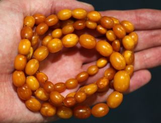 Antique Chinese Carved Butterscotch Amber Bead Necklace,  19th Century.  39 Grams.
