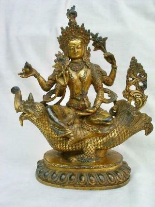 Fine Antique Chinese Tibetan Gilt Bronze Deity Buddha Seated On A Mythical Beast