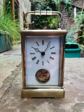 A Rare Quality Carriage Clock With An Unusual Front Facing Rotating Balance