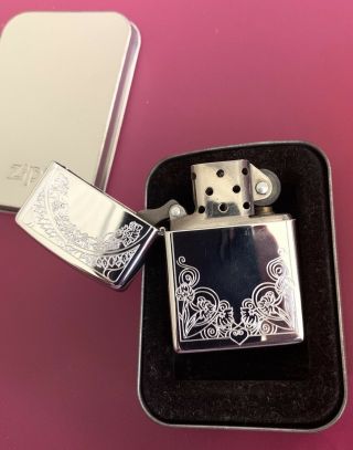 2002 Zippo Lighter - Polished Chrome Etched Arch Swirling Flowers & Heart