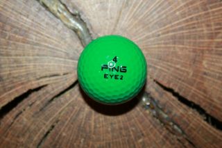 Vintage Green And White Ping Golf Ball