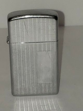 Vintage Zippo Slim Lighter With Straight Line Design With The Flat Bottem