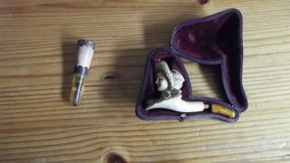 A Meerschaum Pipe And Cigarette Holder.