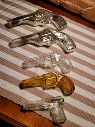5 Antique/vtg.  Glass Candy Container Guns,  Pistol,  Revolvers Mercury Amber Clear