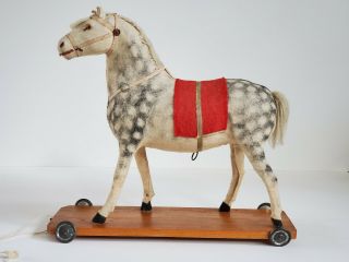 Antique German Horse Pull Toy,  Neigh Squeaker Wood Base Metal Wheels Felt Saddle