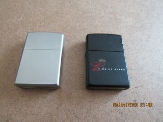 2 vintage Zippo Lighters one black one brushed chrome 2