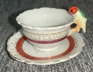 Vintage Japan Porcelain Miniature Parrot Handle Tea Cup And Saucer