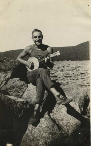 Vintage Photograph Man Sitting On Rocks Playing Small Banjo 1920s - 30s