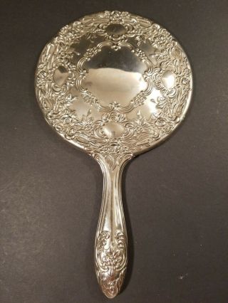 Vintage Silver Toned Hand Held Mirror Raised Floral Design 9 " Tall 5 1/2 " Wide