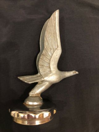 1929 - 1930 Chevrolet Eagle Hood Ornament Mascot.  Threaded Chevrolet Radiator Cap.