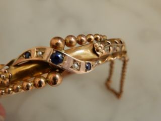 A 9 Ct Rose Gold Antique Blue Sapphire And Seed Pearl Bangle Cased