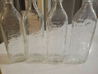 Set Of 4 Vintage Baby Glass Nursing Bottle Embossed Bunny & Dogs Hazel Atlas