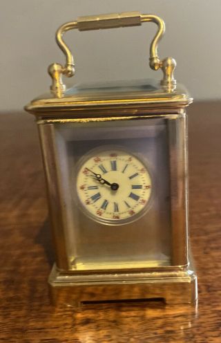 A Miniature Brass And Dark Blue Porcelain Sevres Style Panelled Carriage Clock