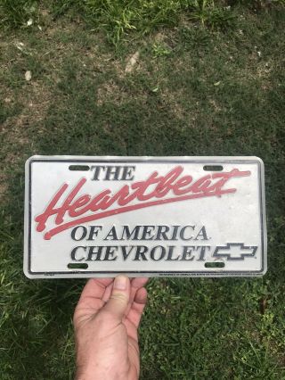 Vintage Silver Chevrolet Heartbeat Of America Dealer Booster License Plate Tag