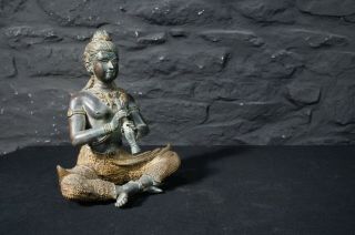 Antique Bronze Indian Statue Of Buddha Playing A Flute In The Lotus Position