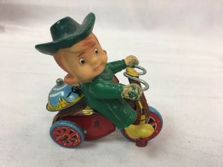 Vintage Marx Tin Wind Up Western Cow Girl Female Cowboy On Tricycle Tin Toy