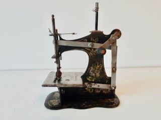 Antique Muller No.  1 front winder tinplate Toy sewing machine 3