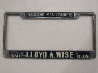 Vintage Oakland Lloyd Wise Oldsmobile Dealership License Plate Frame Metal Rare