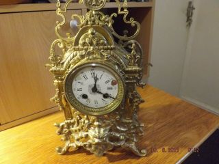 19th Century Brass Clock With Pendulum