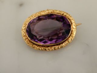 An Exceptional Antique Gold Oval 12.  00 Carat Amethyst Brooch