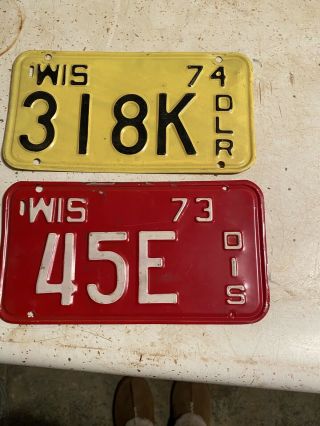 (2) 1974 And 1973 Wisconsin Motorcycle Dealer License Plates
