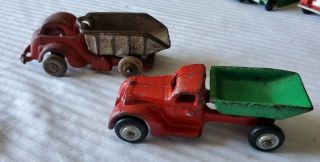 2 Antique Red Hubley Cast Iron Dump Trucks 2308 Made Usa.  One Green /one Silver