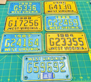 (7) West Virginia Motor Cycle License Plates 1984,  1985,  1986,  1987,  1988,  1989,  1.