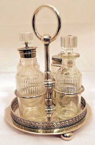 A Victorian Silver - Plated 4 - Bottle Cruet Set,  Sheffield C.  1870.