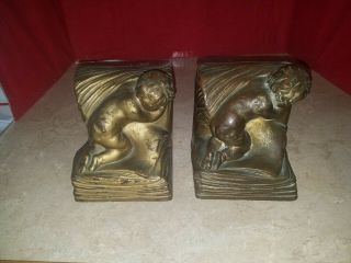 Antique A.  Johnson Signed Bookends " Baby In A Book " Bronze Clad Armor Bronze Co.