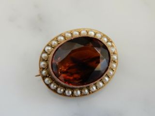 An Antique Gold Oval 7.  00 Carat Dark Citrine & Seed Pearl Brooch