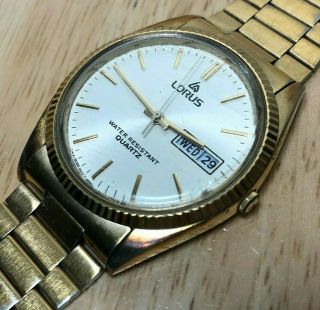 Vintage Lorus Men Gold Tone Fluted Bezel Quartz Watch Hours Day Date Battery