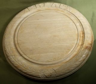 Vintage Carved Wood Bread Board 11 3/4 Inches Diameter.